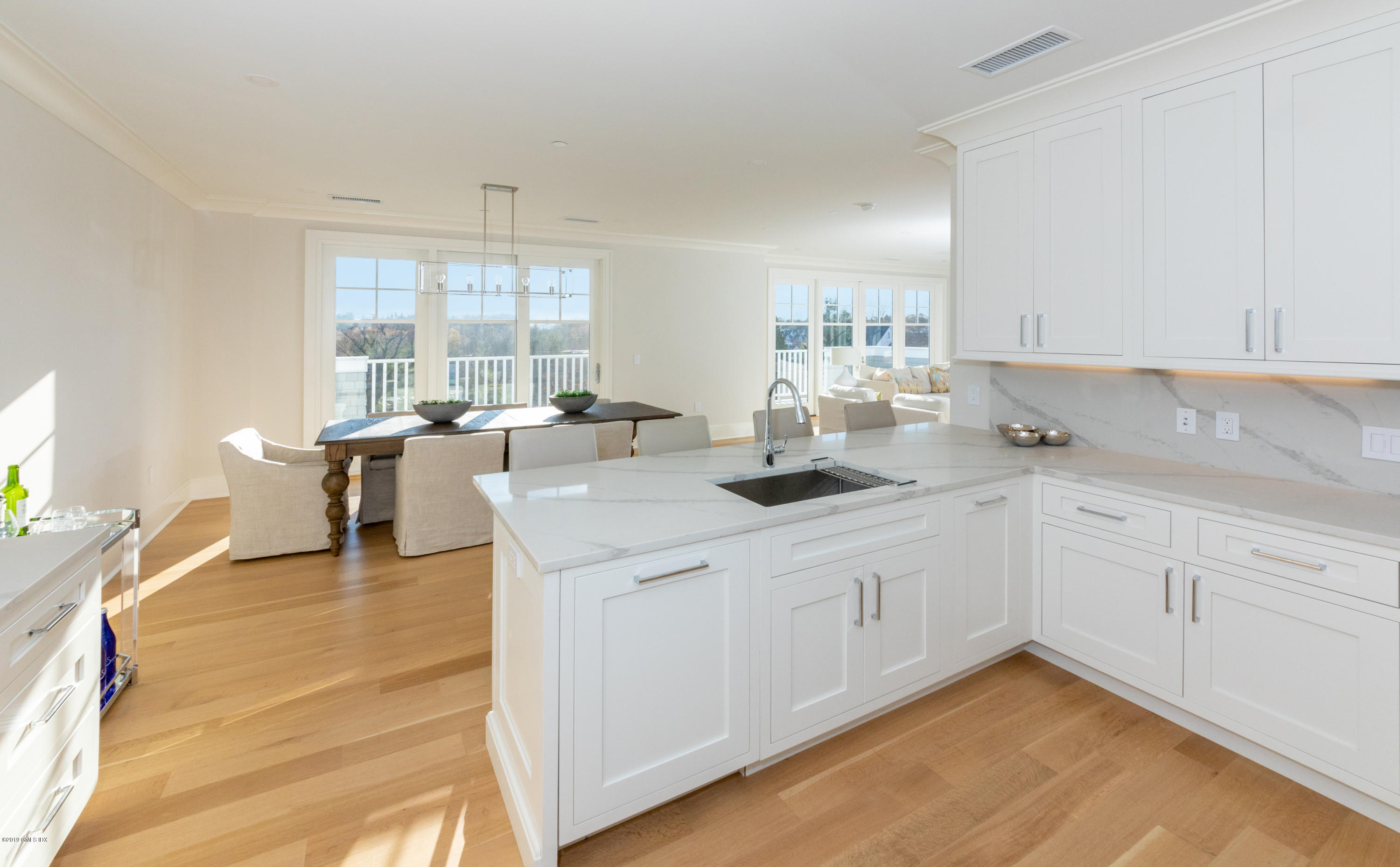 70 Sound View Drive, Unit PH WEST Greenwich, CT 06830 - Photo 4 of 16 a kitchen with a sink cabinets and window