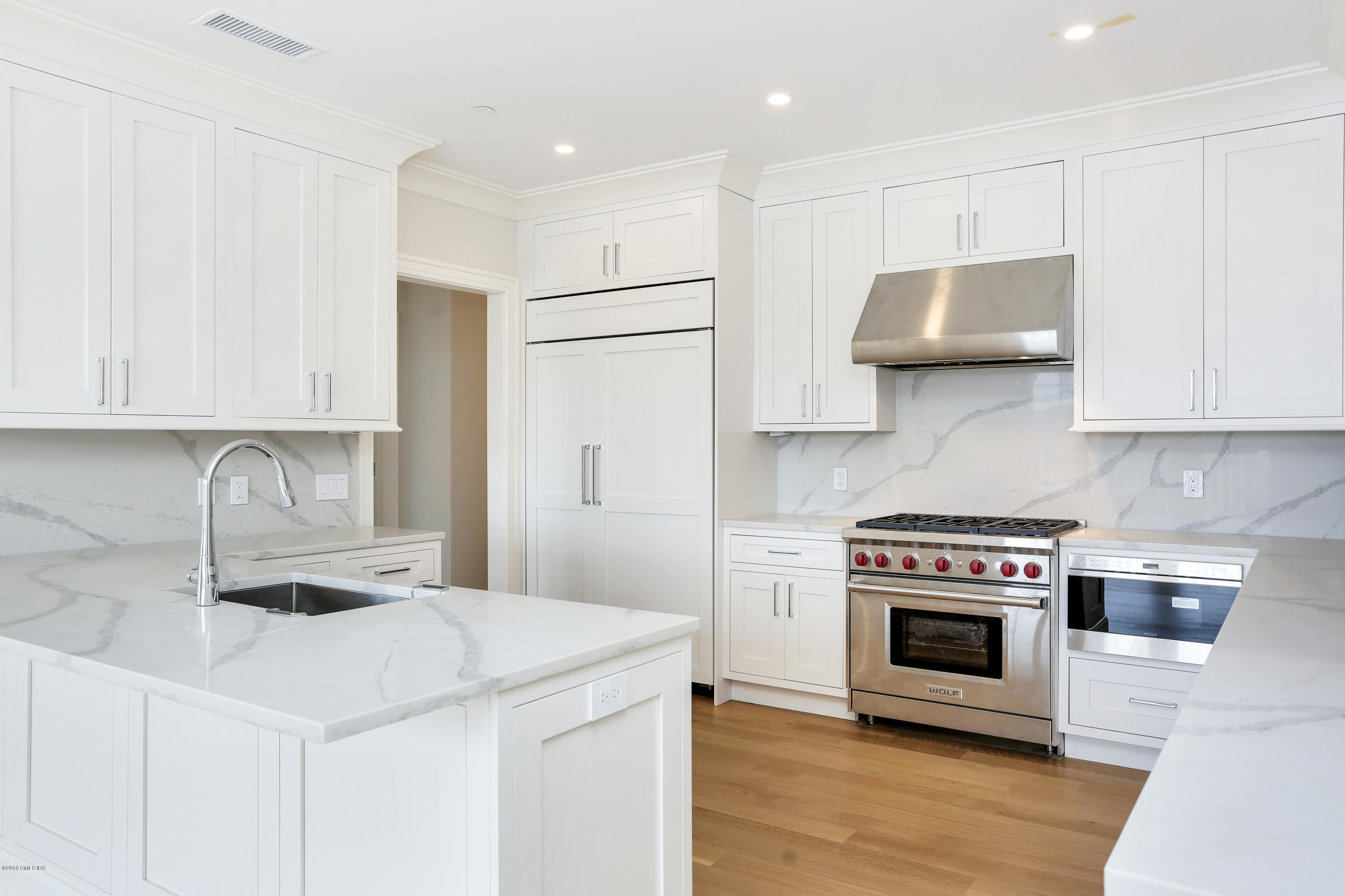 70 Sound View Drive, Unit PH WEST Greenwich, CT 06830 - Photo 5 of 16 a kitchen with stainless steel appliances a stove a sink and a microwave