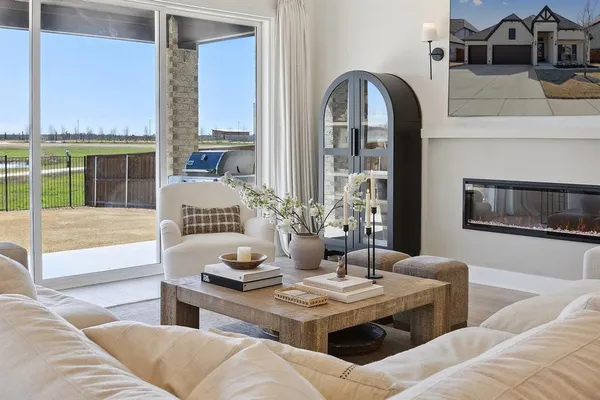 a living room with furniture and fireplace