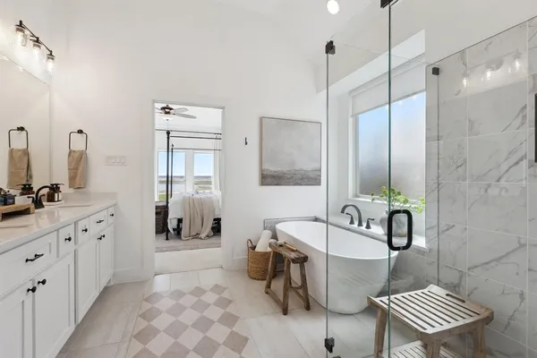 a spacious bathroom with a bathtub sink and toilet