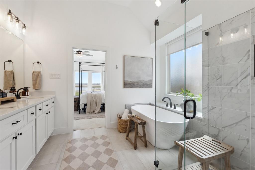 2107 Ozarks Court Forney, TX 75126 - Photo 25 of 40 a spacious bathroom with a bathtub sink and toilet