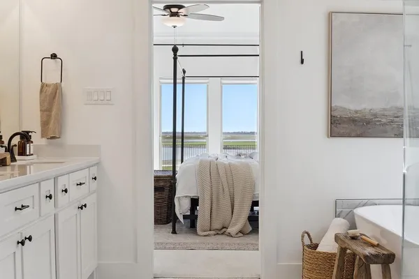 a bathroom with a sink and mirror with toilet