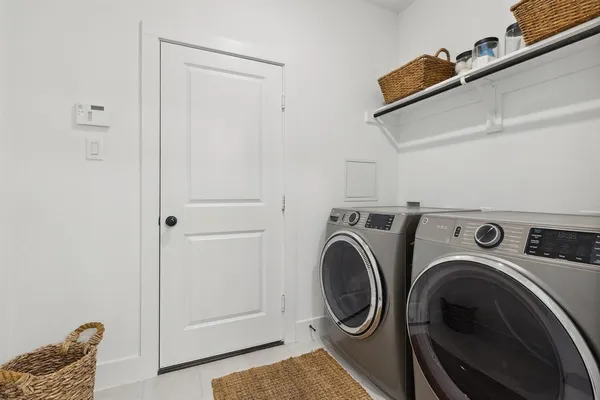 a view of storage and utility room with washer and dryer