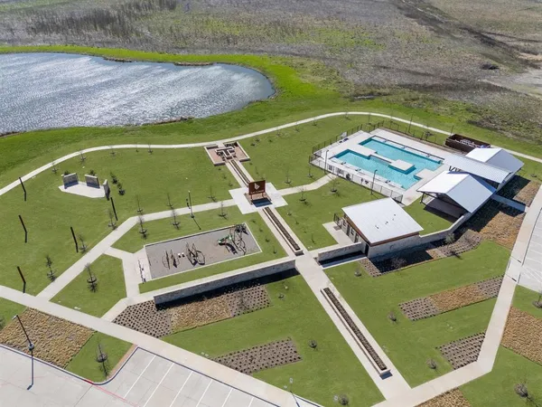 a view of a pool with chairs