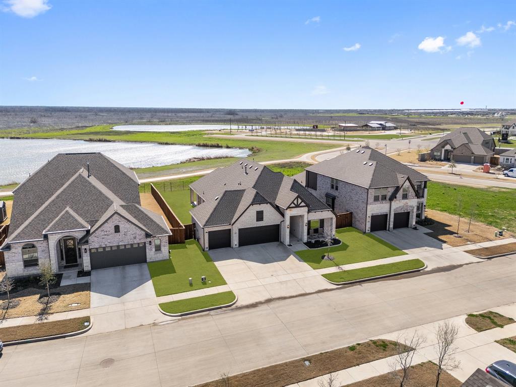 2107 Ozarks Court Forney, TX 75126 - Photo 40 of 40 an aerial view of a house with a swimming pool and outdoor seating