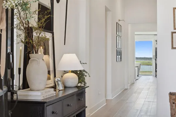 a view of living room with furniture and wooden floor