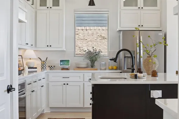 a kitchen with appliances cabinets and a window