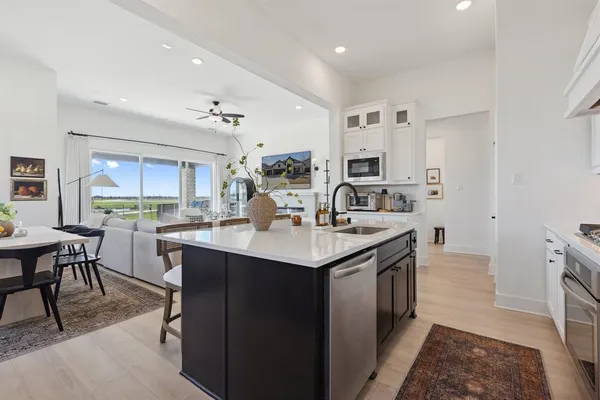 a kitchen with a sink and cabinets