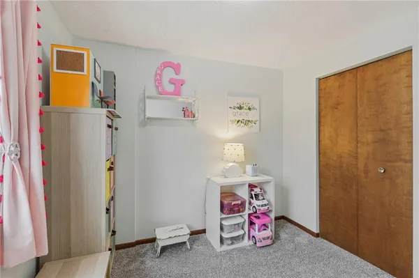 a bed room with furniture and window