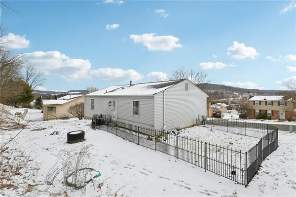 a view of wooden fence of a house