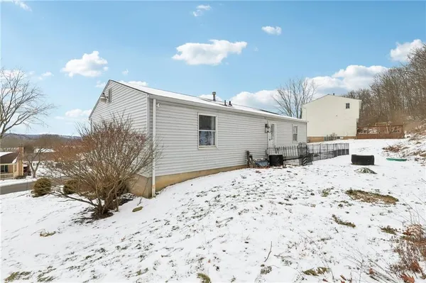 a view of a big house with a big yard