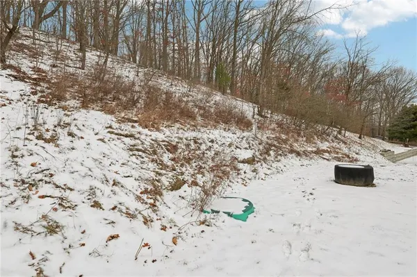 a front view of a building with a garden