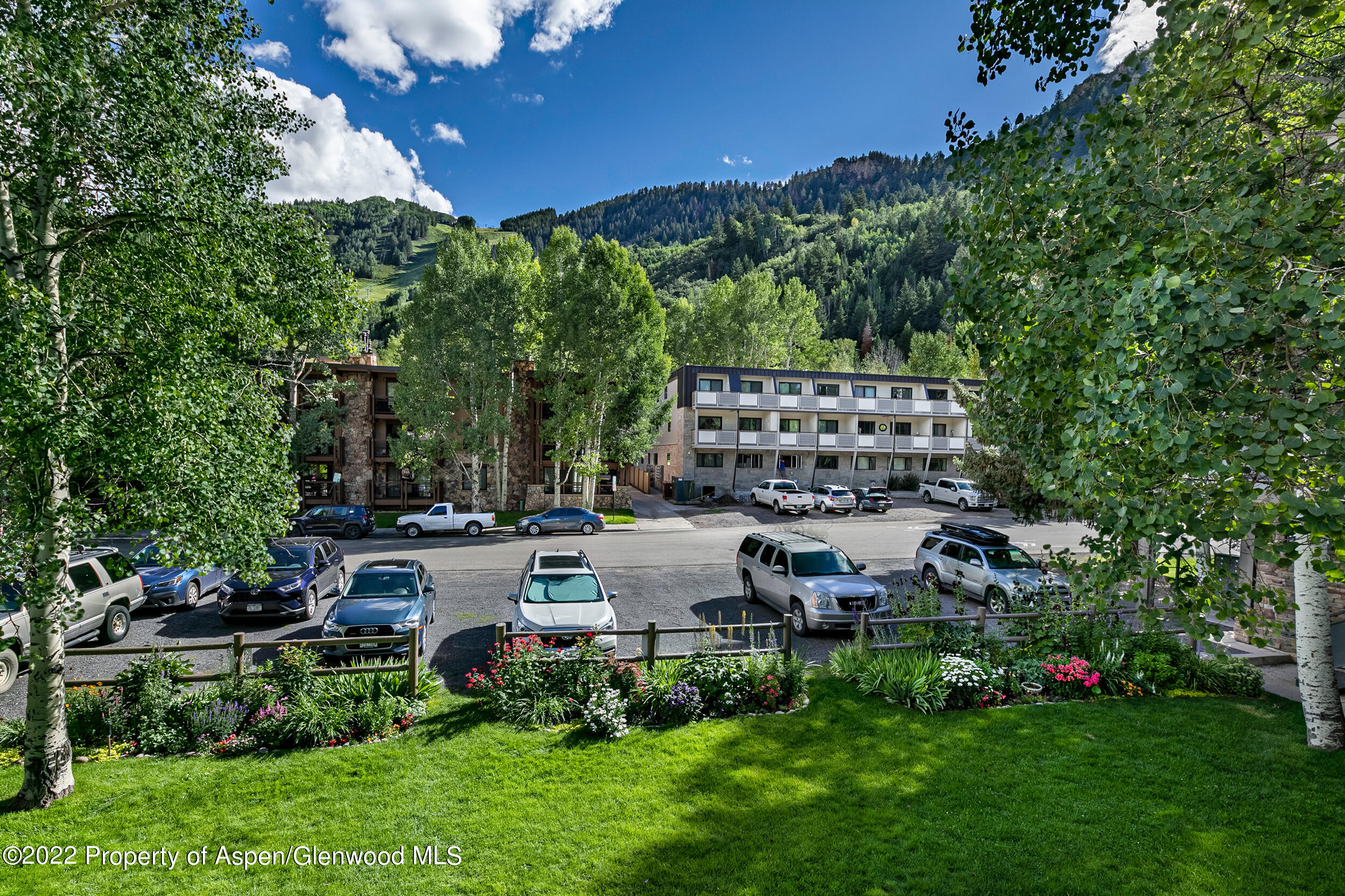 124 East Durant Avenue, Unit 4 Aspen, CO 81611 - Photo 13 of 13 a view of a house with a yard and sitting area