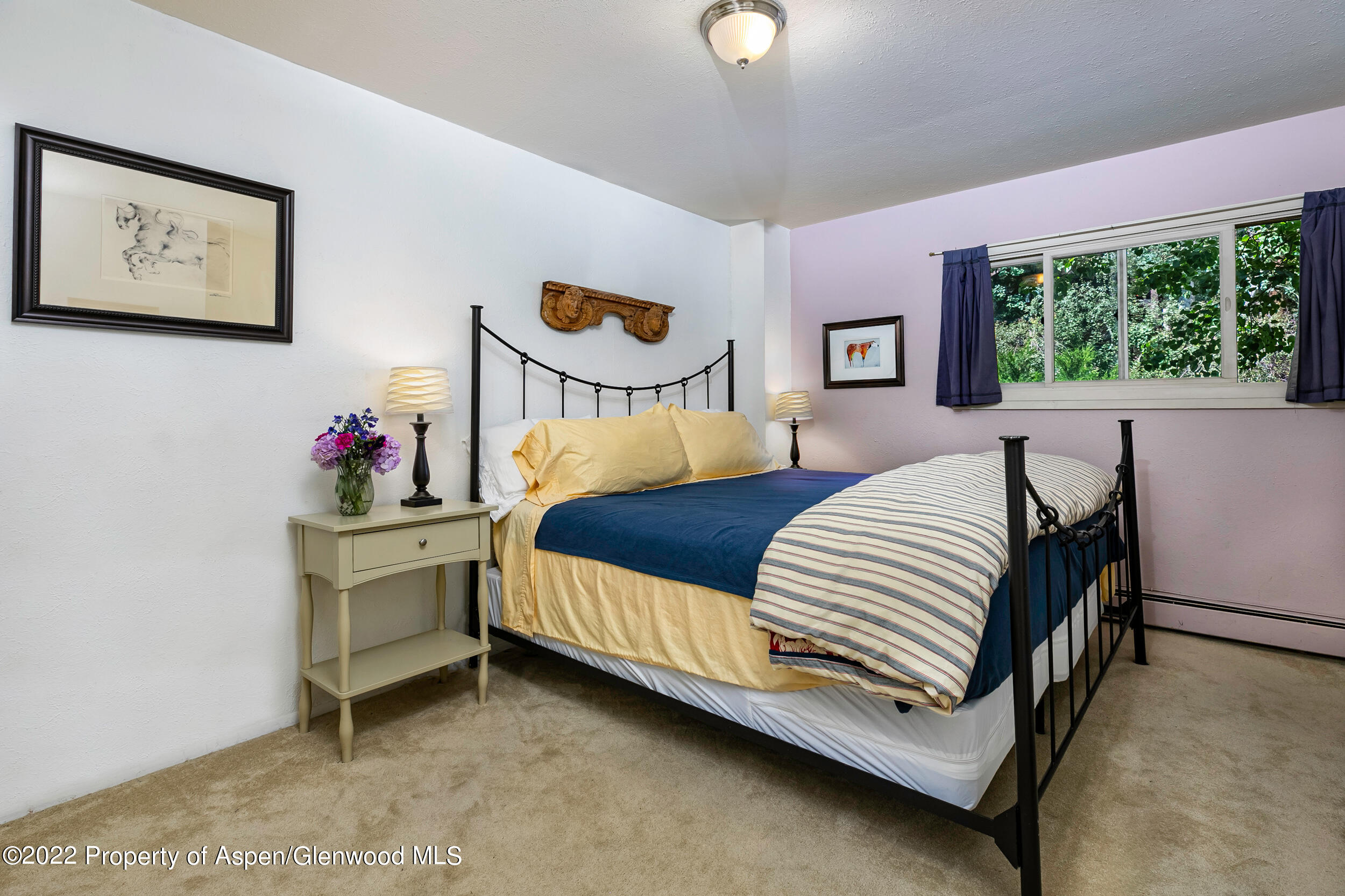 124 East Durant Avenue, Unit 4 Aspen, CO 81611 - Photo 5 of 13 a bed room with a bed and a desk