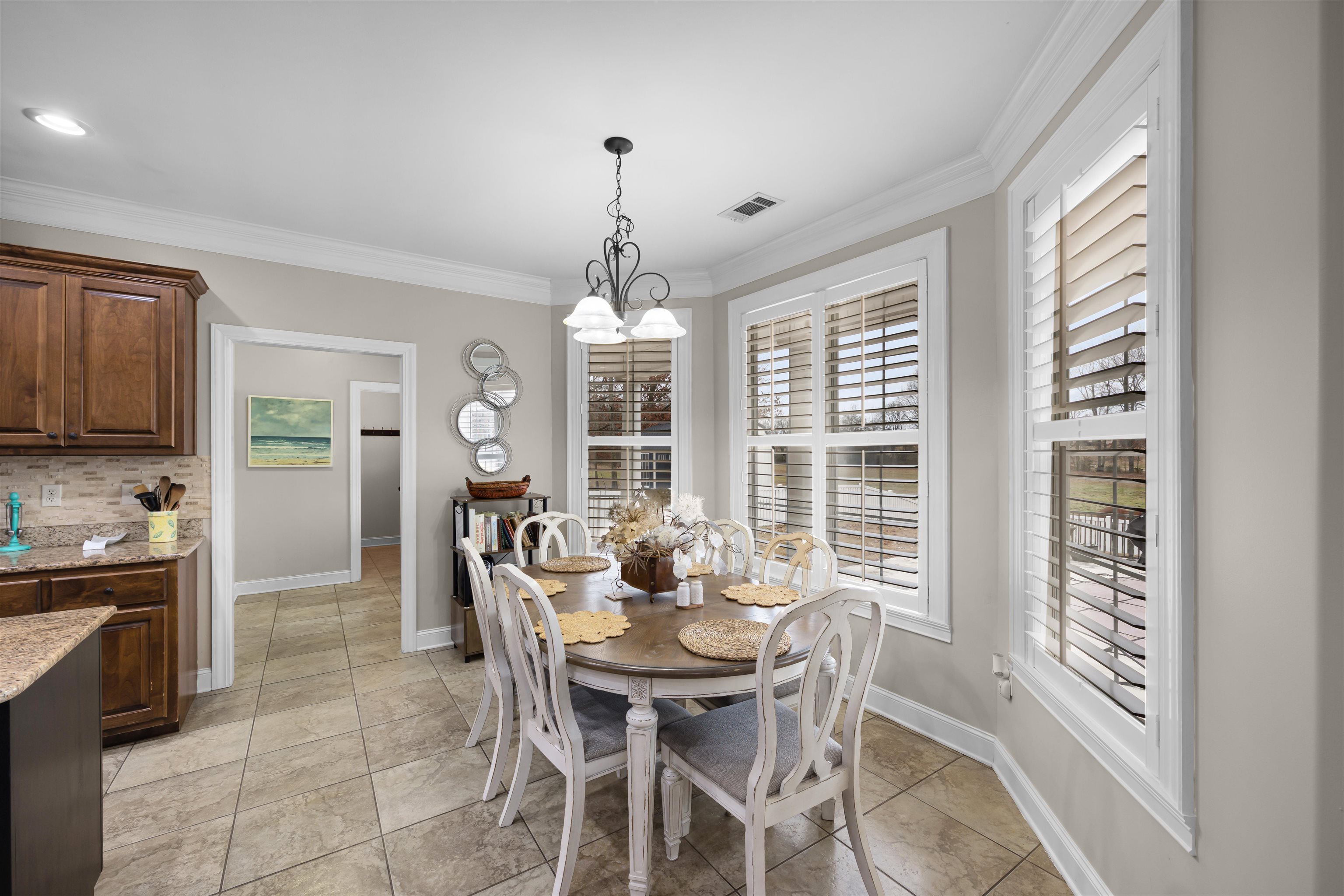 3285 Shadowood Lane Corinth, MS 38834 - Photo 13 of 30 Dining space with a chandelier and ornamental molding