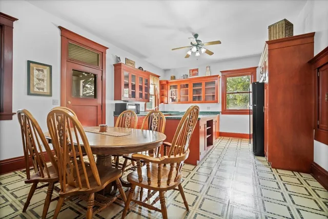 a dining room with furniture and window