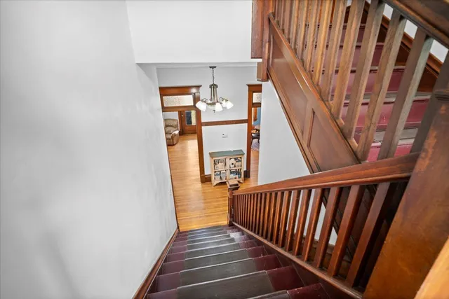 a view of a garage with rack and bicycle