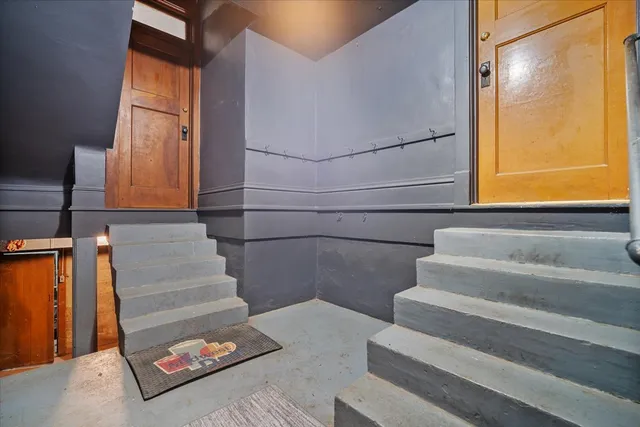 a view of a porch with wooden floor and fence