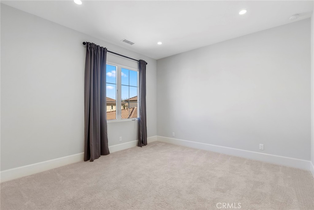 133 Donati Irvine, CA 92602 - Photo 18 of 20 an empty room with an entryway and wooden floor