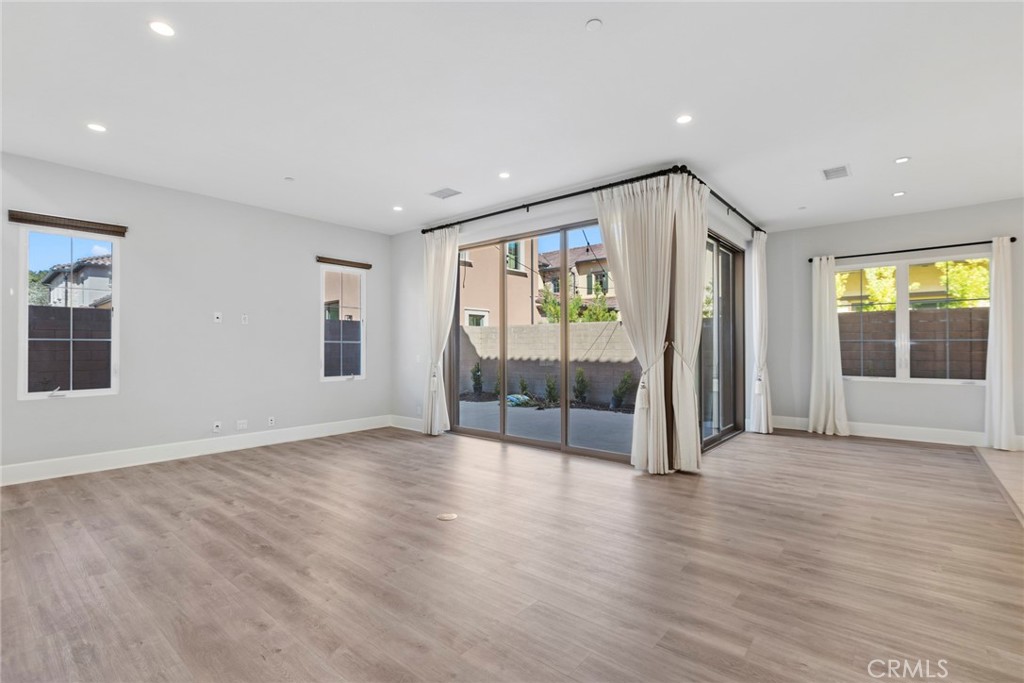 133 Donati Irvine, CA 92602 - Photo 2 of 20 an empty room with wooden floor and windows
