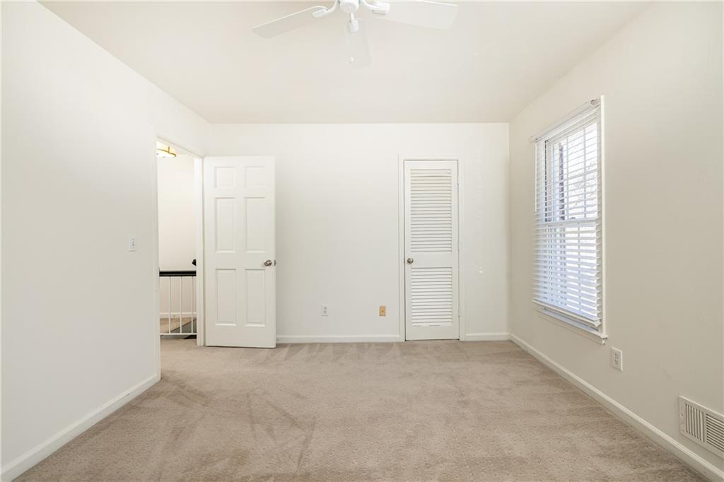 1101 Collier Road Northwest, Unit I3 Atlanta, GA 30318 - Photo 19 of 24 an empty room with windows