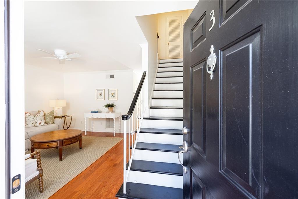 1101 Collier Road Northwest, Unit I3 Atlanta, GA 30318 - Photo 2 of 24 a view of entryway and hall with wooden floor
