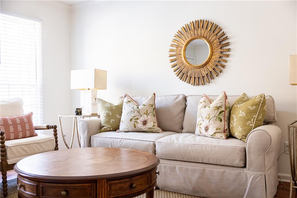 1101 Collier Road Northwest, Unit I3 Atlanta, GA 30318 - Photo 5 of 24 a living room with furniture and a chair