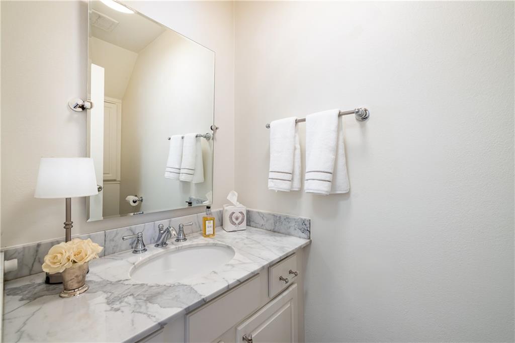 1101 Collier Road Northwest, Unit I3 Atlanta, GA 30318 - Photo 8 of 24 a bathroom with a granite countertop sink and a mirror