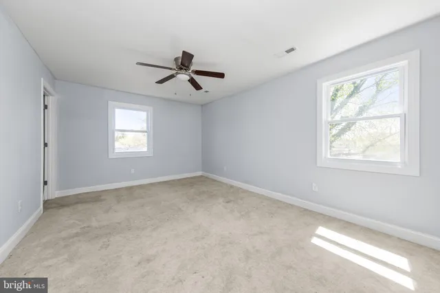 a view of empty room with windows