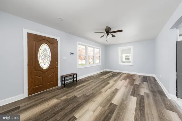 a view of an empty room with a window