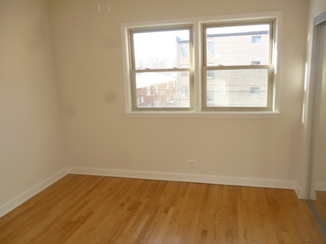 7530 North Ridge Boulevard, Unit 3W Chicago, IL 60645 - Photo 19 of 23 an empty room with a window