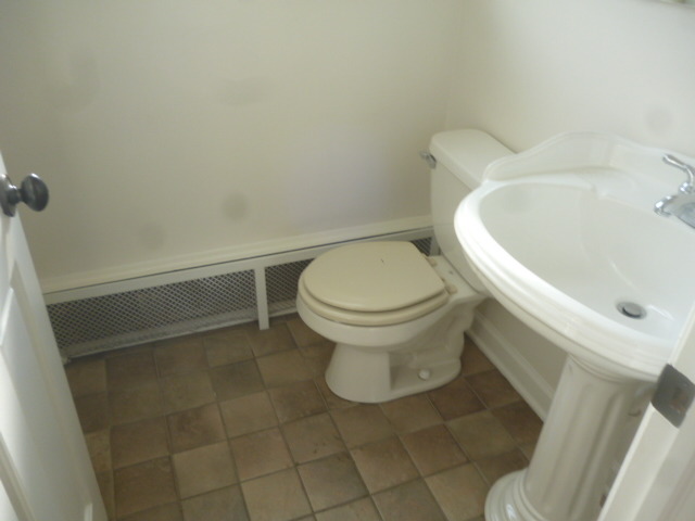 7530 North Ridge Boulevard, Unit 3W Chicago, IL 60645 - Photo 10 of 23 a white toilet sitting next to a white sink