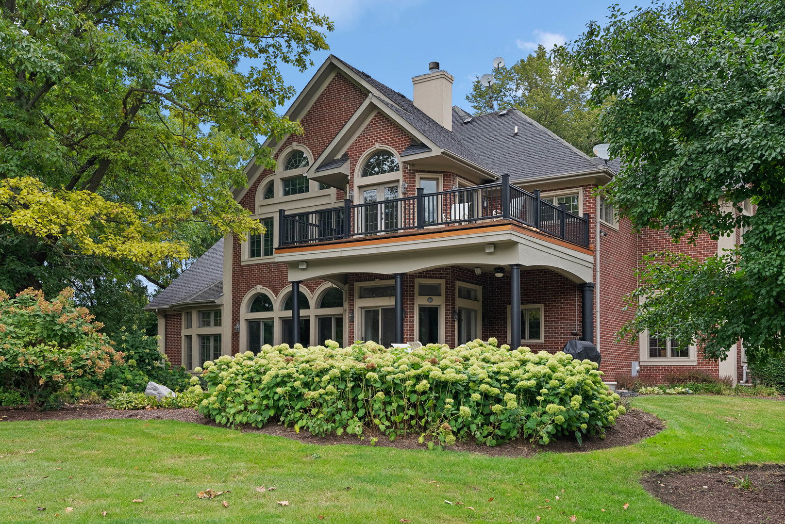 5N156 Dunham Road St. Charles, IL 60174 - Photo 1 of 65 a front view of a house with a garden