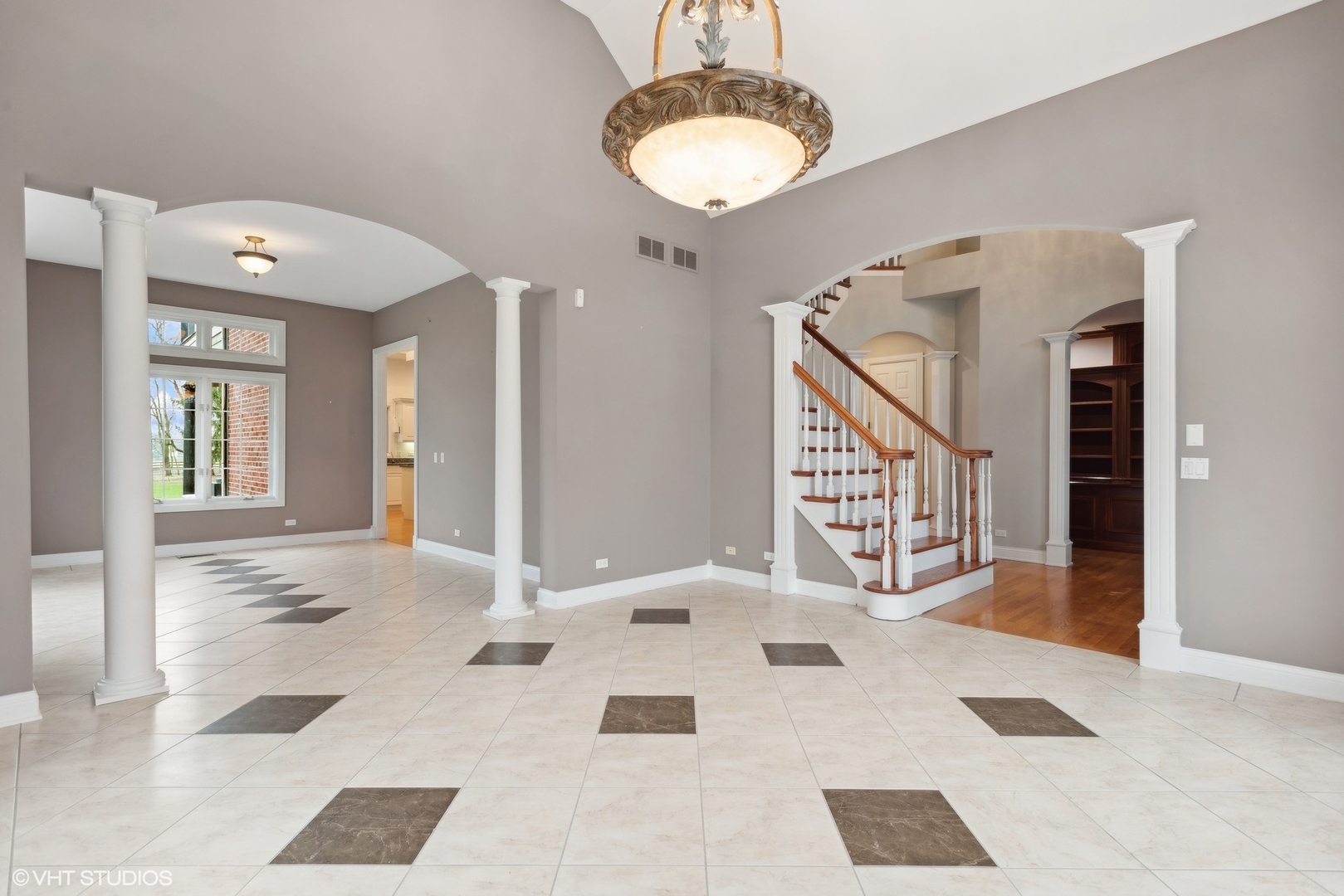 5N156 Dunham Road St. Charles, IL 60174 - Photo 30 of 65 a view of a hallway with windows and chandelier