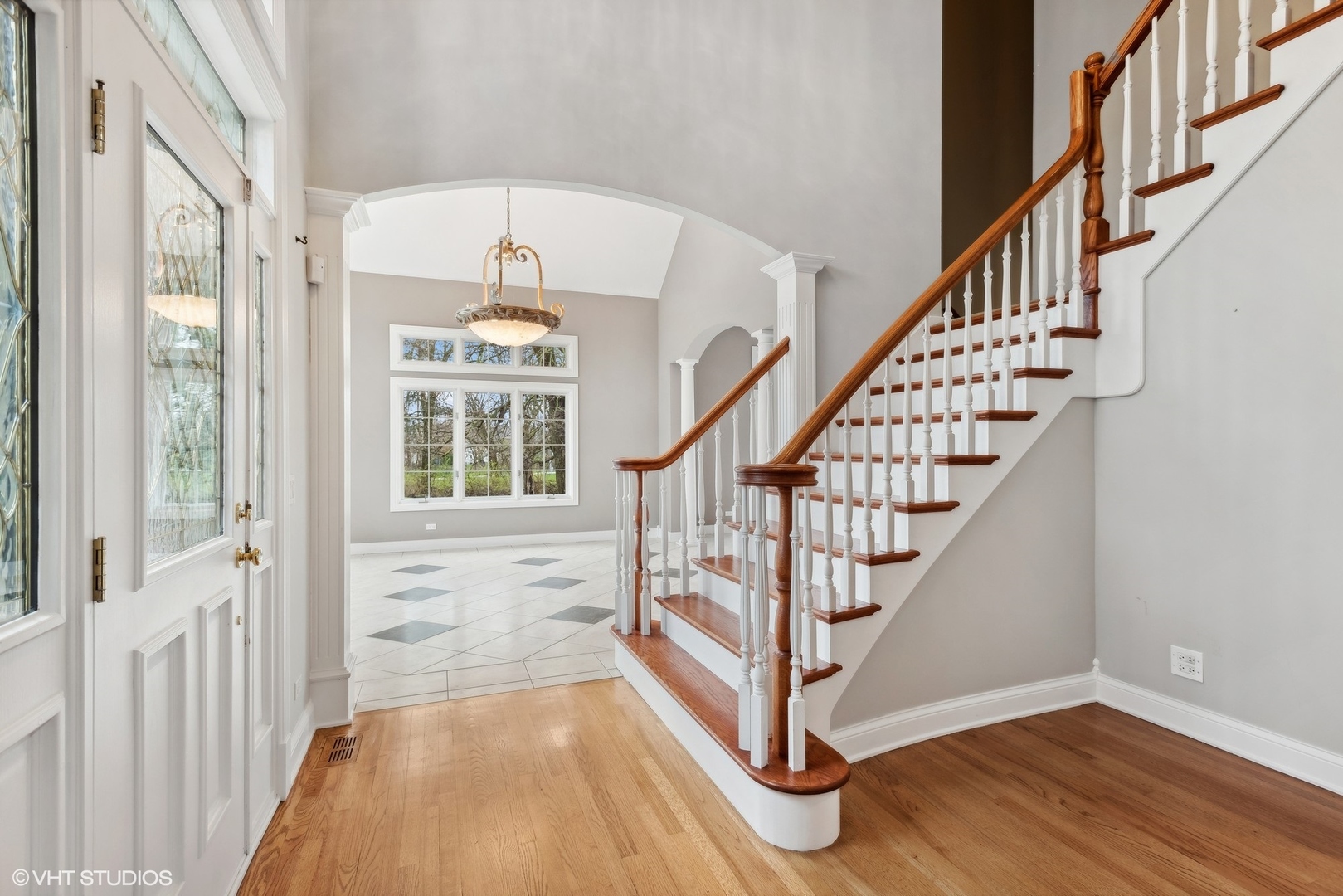5N156 Dunham Road St. Charles, IL 60174 - Photo 32 of 65 a view of entryway with wooden floor and stairs