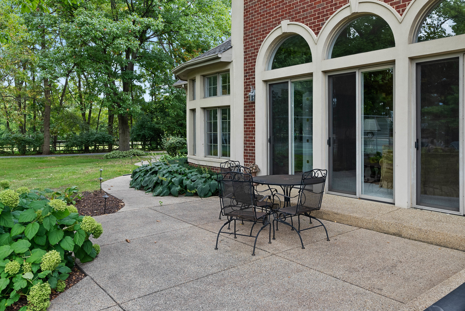 5N156 Dunham Road St. Charles, IL 60174 - Photo 4 of 65 a view of a house with backyard sitting area and garden