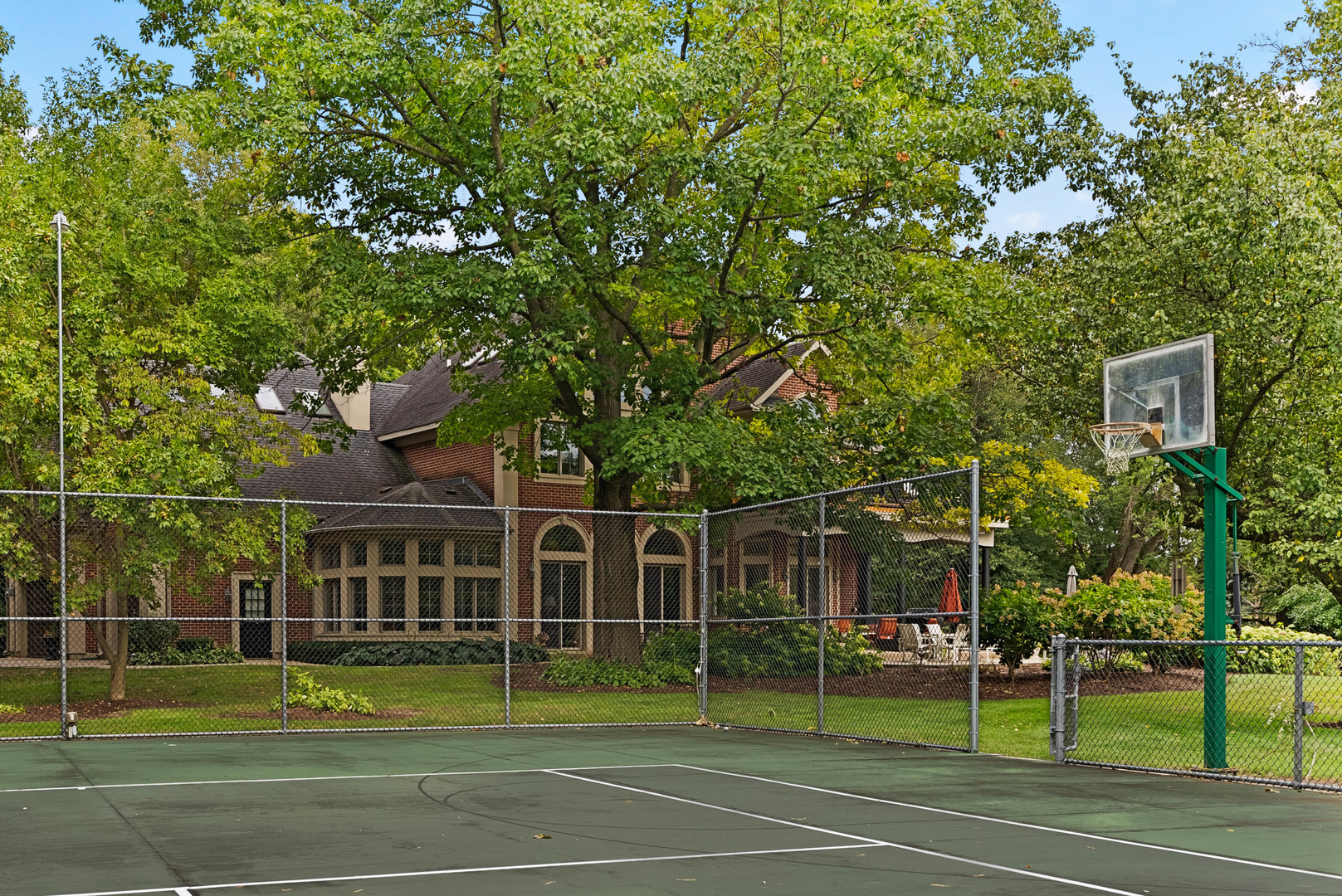 5N156 Dunham Road St. Charles, IL 60174 - Photo 8 of 65 a view of a tennis ground with large trees