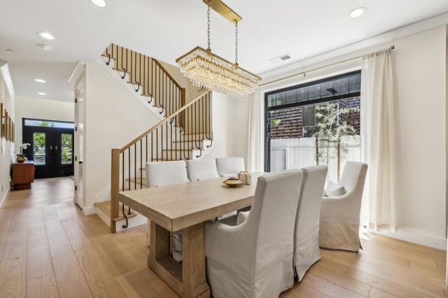 a kitchen that has a lot of cabinets and refrigerator