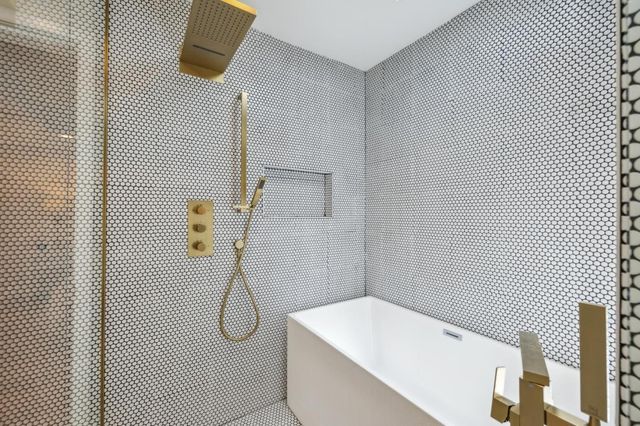 a bedroom with a bed and a book shelf