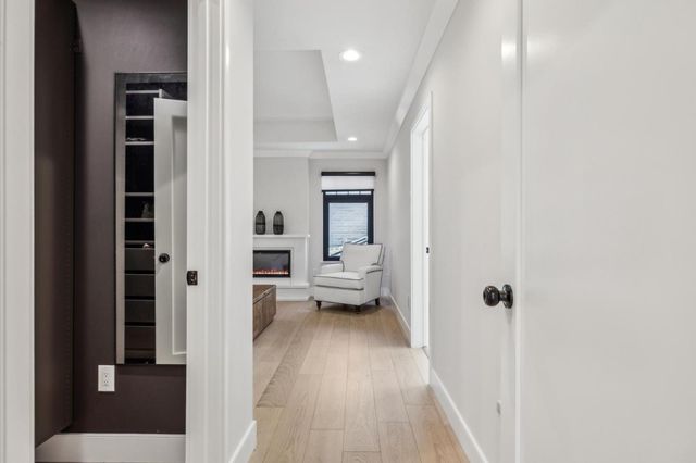 a kitchen with stainless steel appliances granite countertop a sink a stove and a wooden floors