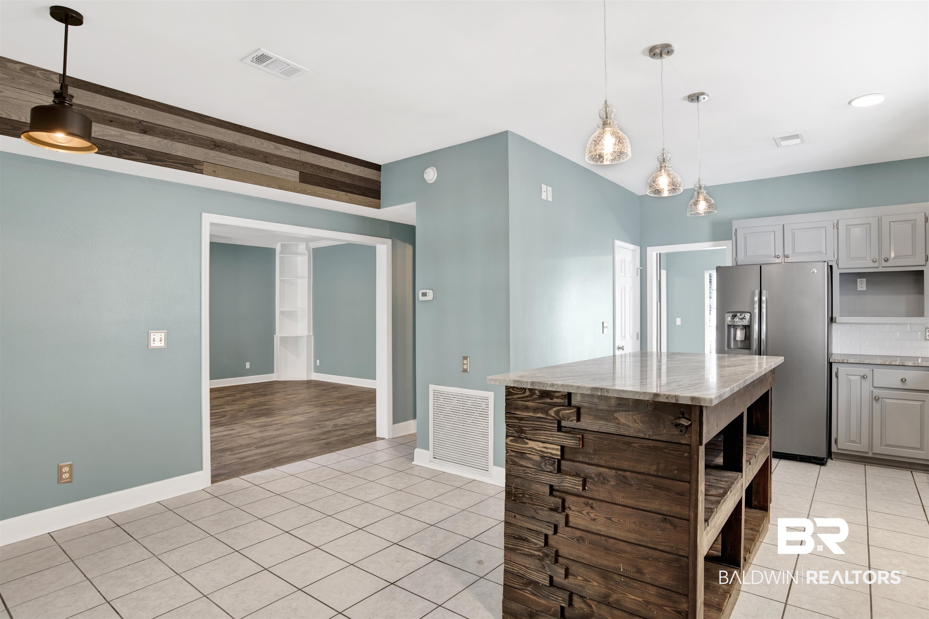 11835 Island Drive Foley, AL 36535 - Photo 27 of 53 Kitchen with open shelves, light tile patterned flooring, and decorative light fixtures