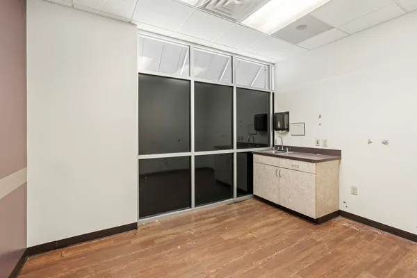 a kitchen with a refrigerator and a sink
