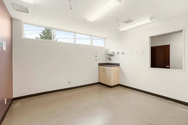 a view of an empty room with windows