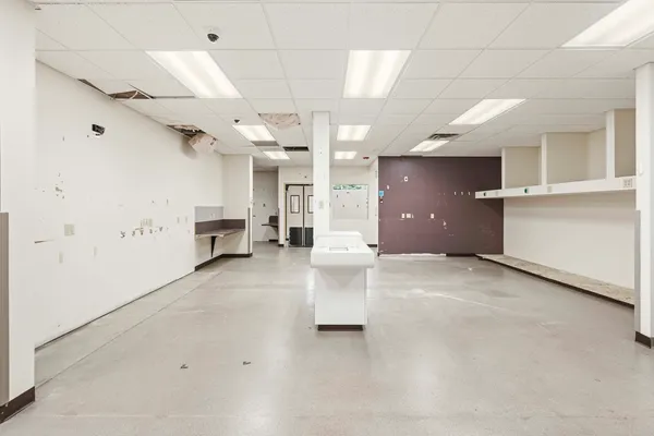 a view of a hallway with kitchen