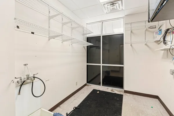 a view of a room with racks on the wall
