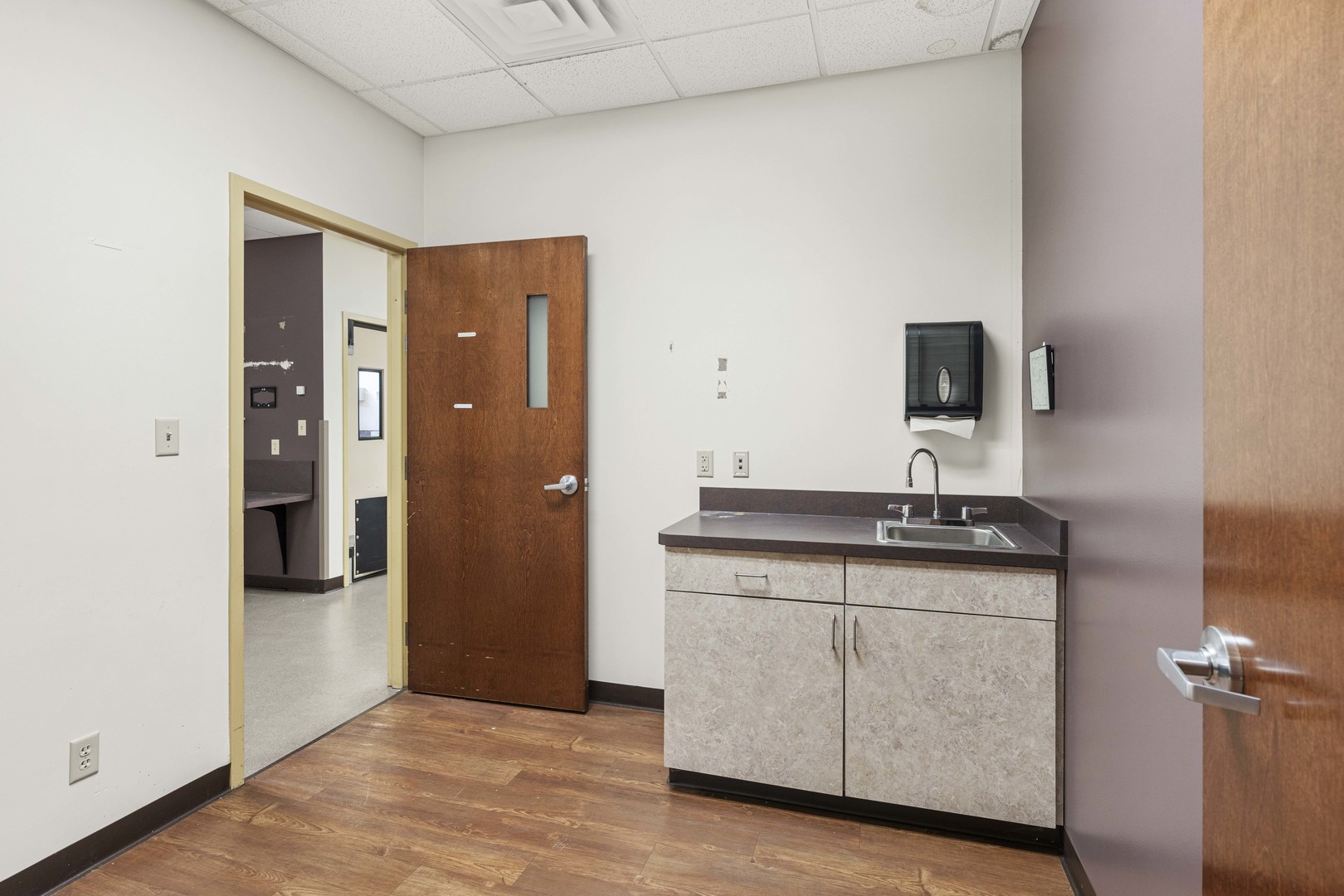 2427 Ridge Road Highland, IN 46322 - Photo 10 of 32 a kitchen with granite countertop a sink and a refrigerator
