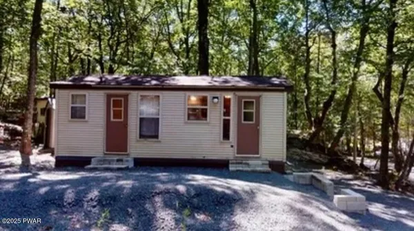 a view of a house with a tree