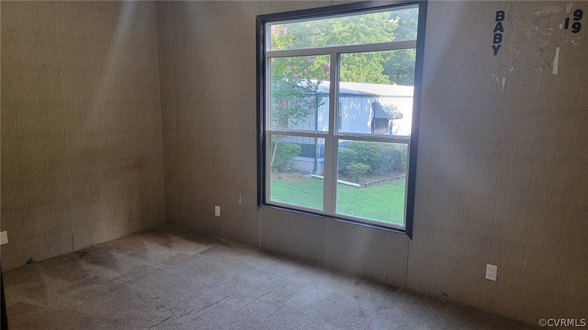 129 Locust Drive Bracey, VA 23919 - Photo 12 of 27 a view of an empty room with a window