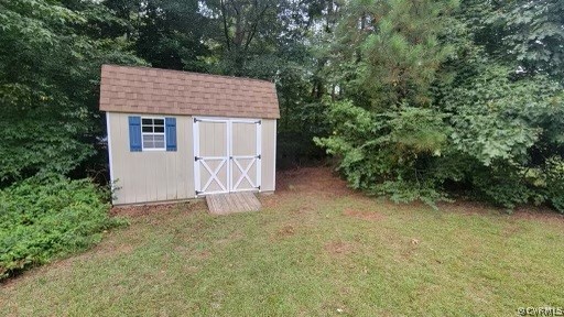129 Locust Drive Bracey, VA 23919 - Photo 19 of 27 a house with a tree in front of it