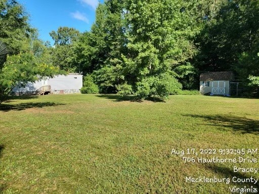 129 Locust Drive Bracey, VA 23919 - Photo 21 of 27 a view of a field with an trees